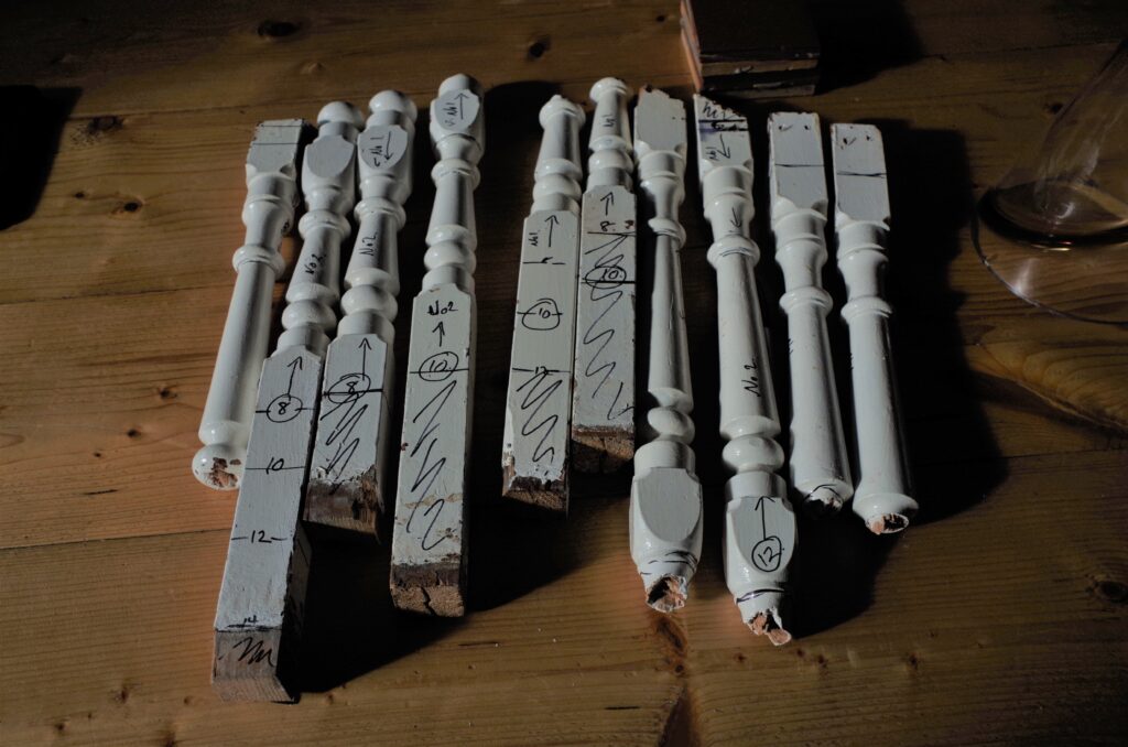 A collection of broken stair spindles